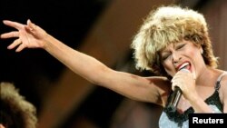 FILE - Tina Turner performs during her "Wildest Dream" tour concert in Basel, Switzerland July 5, 1996.