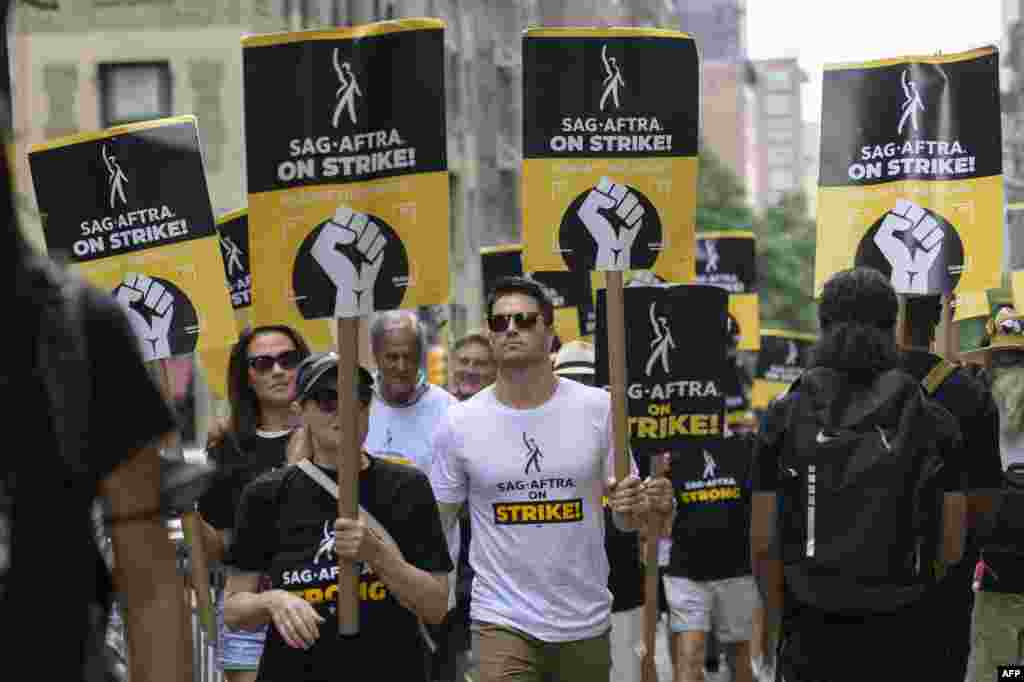 Italia Ricci and Robbie Amell join SAG-AFTRA members on the picket line outside of Warner Bros. Discovery in New York.&nbsp;WGA members marked the 100th day of their industry-crippling strike, dubbing the occasion a &quot;milestone of shame&quot; for studios as the two sides remain deadlocked.&nbsp;