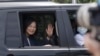FILE - Taiwanese President Tsai Ing-wen waves to the press as she leaves an event at Kaohsiung harbor in Kaohsiung, southern Taiwan, June 10, 2023.