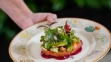 A dish of salmon, avocados, grapefruit, watermelon, radish and cucumber is shown during a media event ahead of the State Dinner for Japan's Prime Minister Fumio Kishida and his spouse Yuko Kishida, at the White House in Washington, DC, on April 9, 2024. (Photo, Drew ANGERER/AFP)