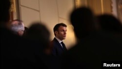 FILE - French President Emmanuel Macron speaks at a conference on euthanasia, after a panel of citizens worked on the issue, at the Elysee Palace in Paris, France, April 3, 2023.