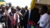 South Sudan Vice President Wani Igga (center) inspects displays by traders at Nyakuron Cultural Center during the third "Made in South Sudan" exhibition in Juba, Feb. 14, 2014. (VOA/Juliana Siapai)