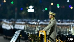 FILE - Myanmar's junta chief military Min Aung Hlaing arrives to deliver a speech during a ceremony to mark the country's Armed Forces Day in Naypyidaw on March 27, 2024. 