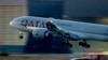FILE - A Qatar airways plane lands at the airport in Frankfurt, Germany, as the sun rises, Sept. 25, 2023. Twelve people were injured when a Qatar Airways plane flying from Doha to Dublin, May 26, 2024 hit turbulence, airport authorities said. 