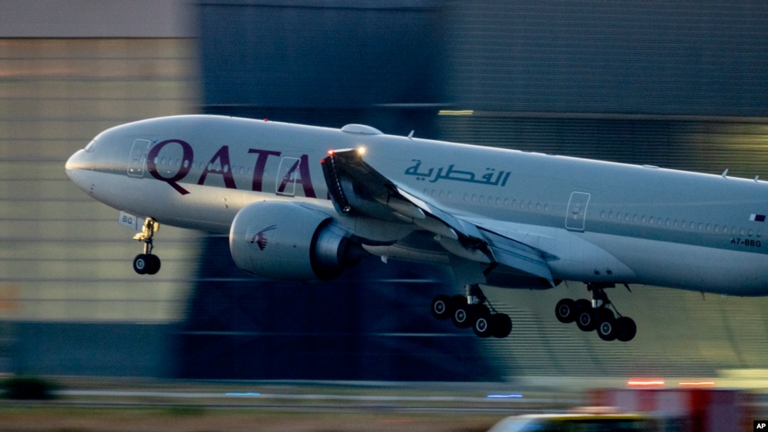 FILE - A Qatar airways plane lands at the airport in Frankfurt, Germany, as the sun rises, Sept. 25, 2023. Twelve people were injured when a Qatar Airways plane flying from Doha to Dublin, May 26, 2024 hit turbulence, airport authorities said. 
