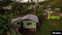 FILE - A view of the inland relocated site of Vunidogoloa Village, Fiji, July 18, 2022. Fiji, an archipelago of hundreds of islands, in 2014 became the first Pacific Island nation to relocate a community because of rising sea levels. 