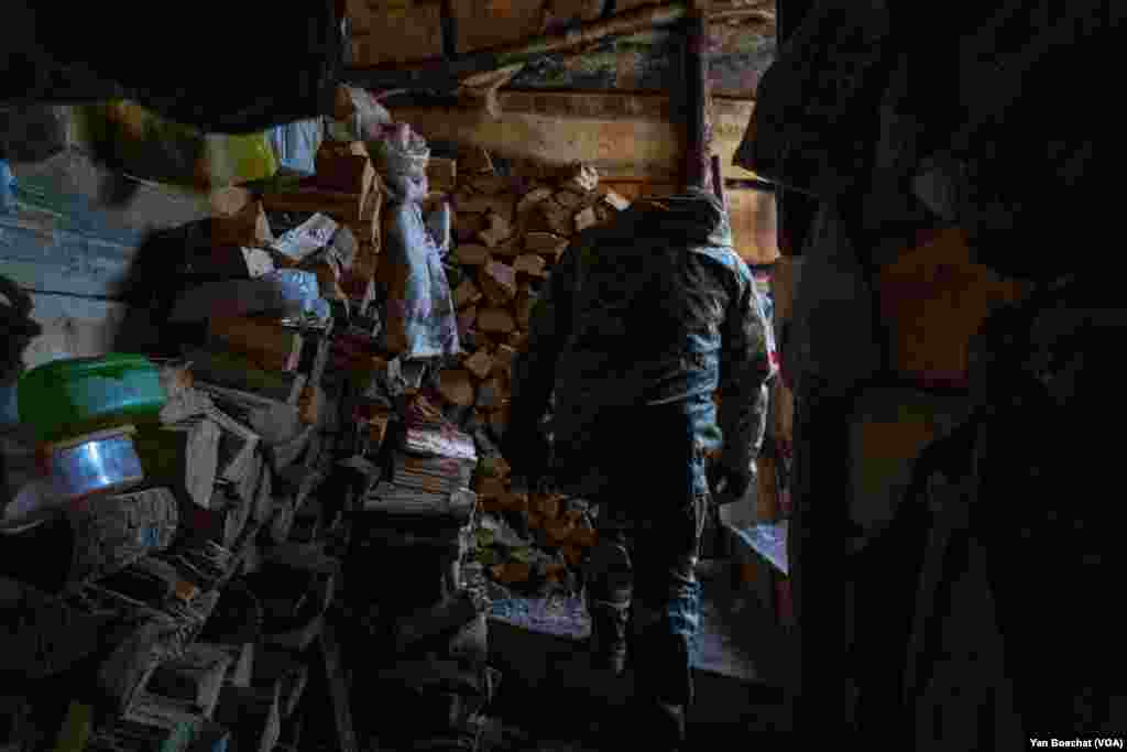 A soldier leaves a bunker inside a maze of trenches in one of the defensive lines built around Kharkiv, Feb. 17, 2023.