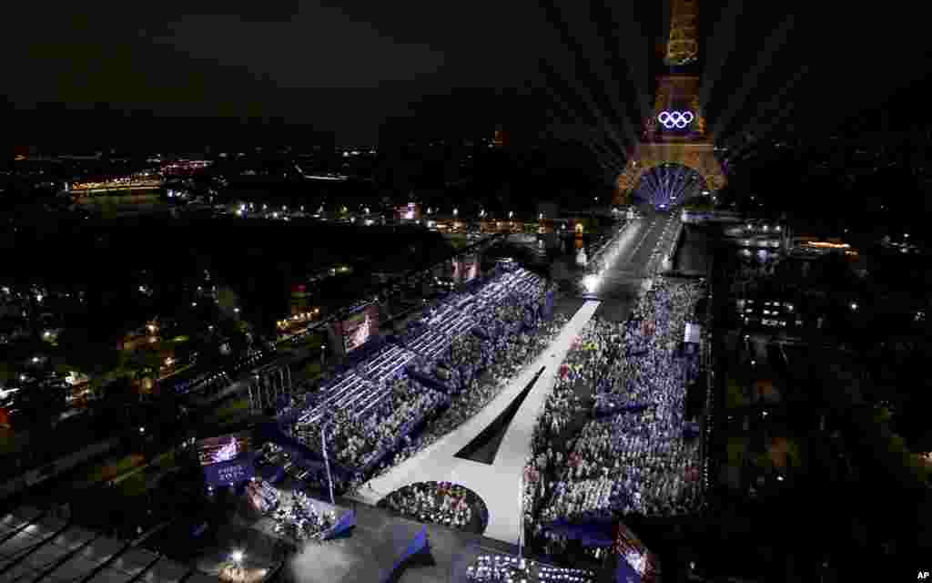 This photo released by the Olympic Broadcasting Services shows the Trocadero and the Eiffel Tower lit up with the Olympic rings during the opening ceremony of the 2024 Summer Olympics in Paris, July 26, 2024.