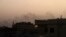 Smoke billows behind buildings in southern Khartoum, on May 27, 2023, amid ongoing fighting between the forces of two rival generals.