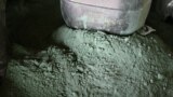 FILE - Raw cobalt powder is pictured after a first transformation at a plant in Lubumbashi on Feb. 16, 2018, before being exported, mainly to China, to be refined.