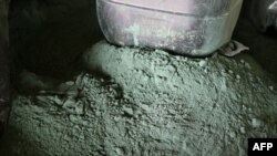 FILE - Raw cobalt powder is pictured after a first transformation at a plant in Lubumbashi on Feb. 16, 2018, before being exported, mainly to China, to be refined.