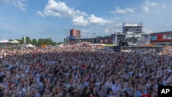 People enjoy a concert at the Atlas Festival in Kyiv, Ukraine, July 21, 2024. 