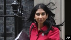 FILE - British Interior Minister Suella Braverman leaves 10 Downing Street to go to the Houses of Parliament in London, on May 22, 2023. Braverman said on Sept. 11, 2023, that the American Bully XL breed was "a clear and lethal danger."