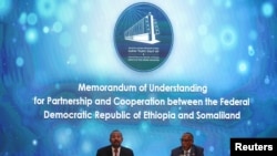 Ethiopia’s Prime Minister Abiy Ahmed and Somaliland's President Muse Bihi Abdi attend the signing of the Memorandum of Understanding agreement, that allows Ethiopia to use a Somaliland port, in Addis Ababa, Ethiopia on January 1, 2024. 