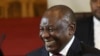 FILE - South African President Cyril Ramaphosa smiles as he delivers the state of the nation address in Cape Town, South Africa, Thursday, February 8, 2024. 