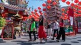 FILE - Chinese tourists visit Pung Tao Gong Chinese Temple in Chiang Mai province, northern Thailand, Jan. 23, 2023. 