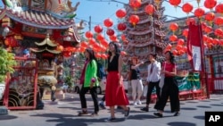 FILE - Chinese tourists visit Pung Tao Gong Chinese Temple in Chiang Mai province, northern Thailand, Jan. 23, 2023. 