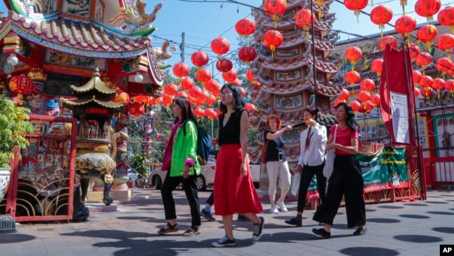 FILE - Chinese tourists visit Pung Tao Gong Chinese Temple in Chiang Mai province, northern Thailand, Jan. 23, 2023.