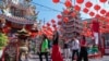 FILE - Chinese tourists visit Pung Tao Gong Chinese Temple in Chiang Mai province, northern Thailand, Jan. 23, 2023. 