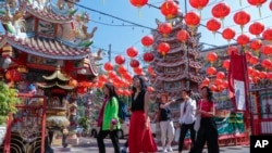 FILE - Chinese tourists visit Pung Tao Gong Chinese Temple in Chiang Mai province, northern Thailand, Jan. 23, 2023. 