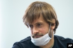FILE - Pyotr Verzilov, prominent member of the protest group Pussy Riot, waits for his court hearing in Moscow on June 25, 2020.