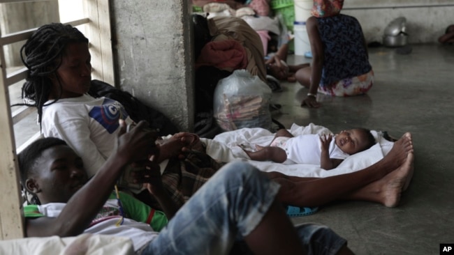 People displaced by the latest episode of gang violence take refuge at a school turned into a shelter, in the Carrefour-Feuilles neighborhood of Port-au-Prince, Haiti, Aug. 16, 2023.