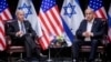 FILE - U.S. President Joe Biden, left, pauses during a meeting with Israeli Prime Minister Benjamin Netanyahu, in Tel Aviv, Israel, Oct. 18, 2023.