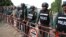 FILE - Cambodian police man a barricade outside a prison in Trapaing Phlong in Tbong Khmum province on September 11, 2017, where opposition leader Kem Sokha is being held after being detained last week.