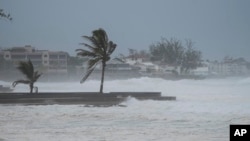 Waves batter a pier as Hurricane Beryl passes through Hastings, Barbados, July 1, 2024. Beryl later made landfall in Grenada.