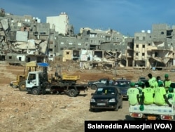 Volunteers from Libya and other parts of the world have come to support survivors of last week's floods, and are still searching for bodies, in Derna, Libya, on Sept. 17, 2023.