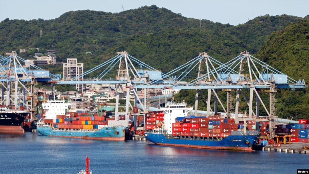 FILE PHOTO: Container ships are seen at the port in Keelung, Taiwan August 6, 2022. REUTERS/Jameson Wu