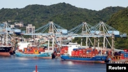 FILE PHOTO: Container ships are seen at the port in Keelung, Taiwan August 6, 2022. REUTERS/Jameson Wu