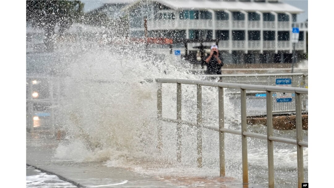 The surf pushed by winds from Tropical Storm Debby breaks over the sea wall in Cedar Key, Florida, Aug. 4, 2024.