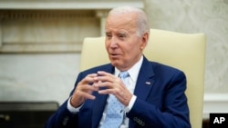 President Joe Biden speaks as he holds a meeting to receive a briefing on Ukraine in the Oval Office of the White House, Oct. 5, 2023, in Washington.