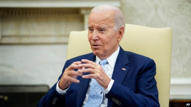 President Joe Biden speaks as he holds a meeting to receive a briefing on Ukraine in the Oval Office of the White House, Oct. 5, 2023, in Washington.