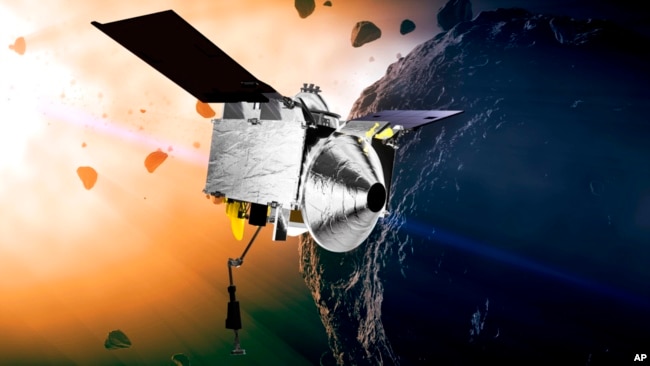 FILE - This illustration provided by NASA depicts the Osiris-Rex spacecraft at the asteroid Bennu.