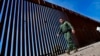 FILE - A Border Patrol deputy chief, Justin De La Torre, walks along the fence of the U.S.-Mexico border on Aug. 29, 2023, near Lukeville, Arizona. U.S. officials said on Oct. 25 that they have seen no indication of Hamas-directed foreign fighters trying to sneak into the U.S.