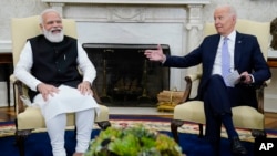 FILE - U.S. President Joe Biden meets with India Prime Minister Narendra Modi in the Oval Office of the White House in Washington, Sept. 24, 2021. Biden is honoring Modi with a state visit this week. Modi arrives in the U.S. on Wednesday,