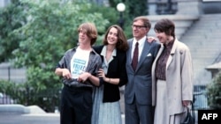 FILE - American journalist Nicholas Daniloff, second from right, poses in Washington, D.C., Oct. 1, 1986, after his release from custody following his arrest in Moscow.