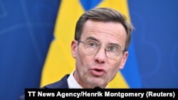 Swedish Prime Minister Ulf Kristersson speaks in Stockholm, Sweden, Oct. 12, 2023. A day later, he said Sweden has done all it can to satisfy an agreement with Turkey that will secure Sweden's path to NATO membership. (TT News Agency/Henrik Montgomery via Reuters)