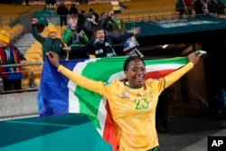 FILE - South Africa's Wendy Shongwe celebrates with the national flag after the Women's World Cup soccer match between South Africa and Italy in Wellington, New Zealand, Aug. 2, 2023. (AP Photo/Alessandra Tarantino)