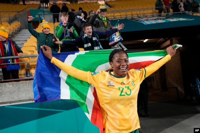 FILE - South Africa's Wendy Shongwe celebrates with the national flag after the Women's World Cup soccer match between South Africa and Italy in Wellington, New Zealand, Aug. 2, 2023. (AP Photo/Alessandra Tarantino)