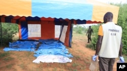 FILE - Body bags with victims of a Christin cult are seen during the exhumation from a forest at Shakahola on the outskirts of Malindi town, Kenyan Coast, April 25, 2023.