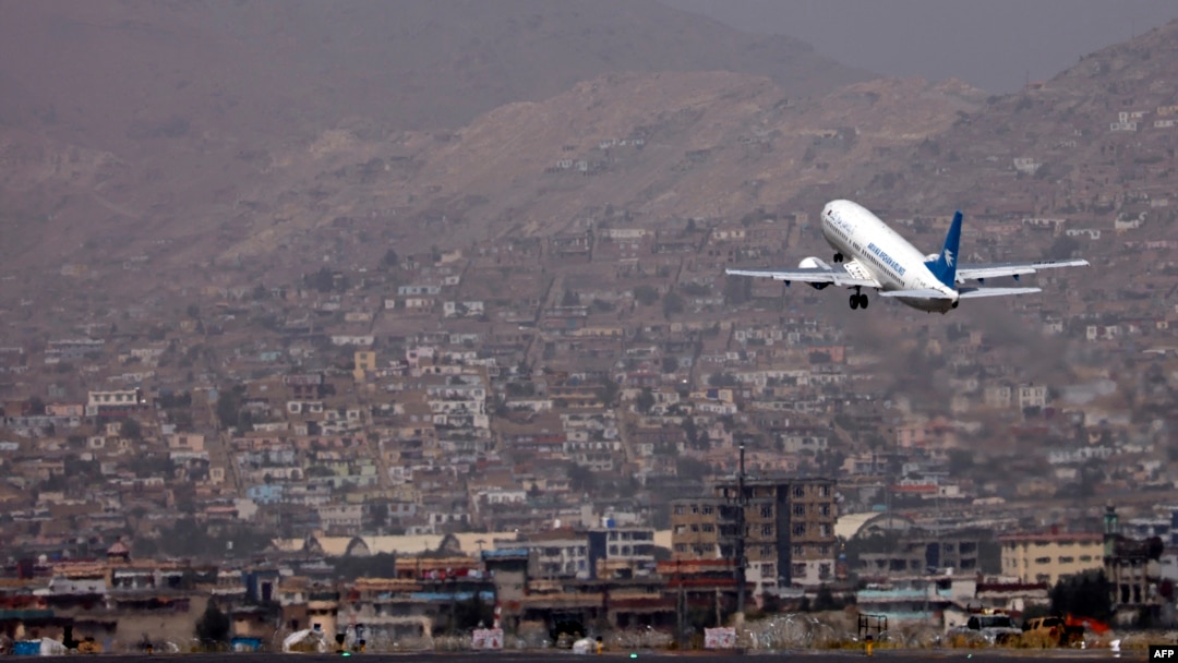FILE - An Ariana Afghan Airlines aircraft takes off from the airport in Kabul, Sept. 11, 2021.