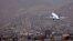 FILE - An Ariana Afghan Airlines aircraft takes off from the airport in Kabul, Sept. 11, 2021.