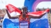 Sifan Hassan, of the Netherlands, celebrates after crossing the finish line to win the gold medal at the end of the women's marathon competition at the 2024 Summer Olympics, Aug. 11, 2024, in Paris. 