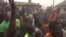 FILE - This video grab taken from an AFPTV video on March 7, 2024 shows families of abducted pupils gathering during the visit of the Kaduna State governor Uba Sani after gunmen kidnapped over 280 from a school in Kuriga.