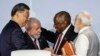 Chinese President Xi Jinping, Brazilian President Luiz Inacio Lula da Silva, South African President Cyril Ramaphosa and Indian Prime Minister Narendra Modi confer during the BRICS Summit in Johannesburg, Aug. 24, 2023.