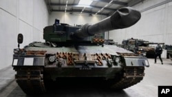 FILE - German-made Leopard 2 tanks are seen at a production facility in Unterluess, Germany, Feb. 12, 2024.