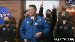In this still image from a July 6, 2024, NASA TV broadcast, NASA astronaut and deputy director, Flight Operations Kjell Lindgren, center, speaks as crew members, left to right, Kelly Haston, Ross Brockwell, Nathan Jones and Anca Selariu exit the Mars habitat in Houston, Texas.